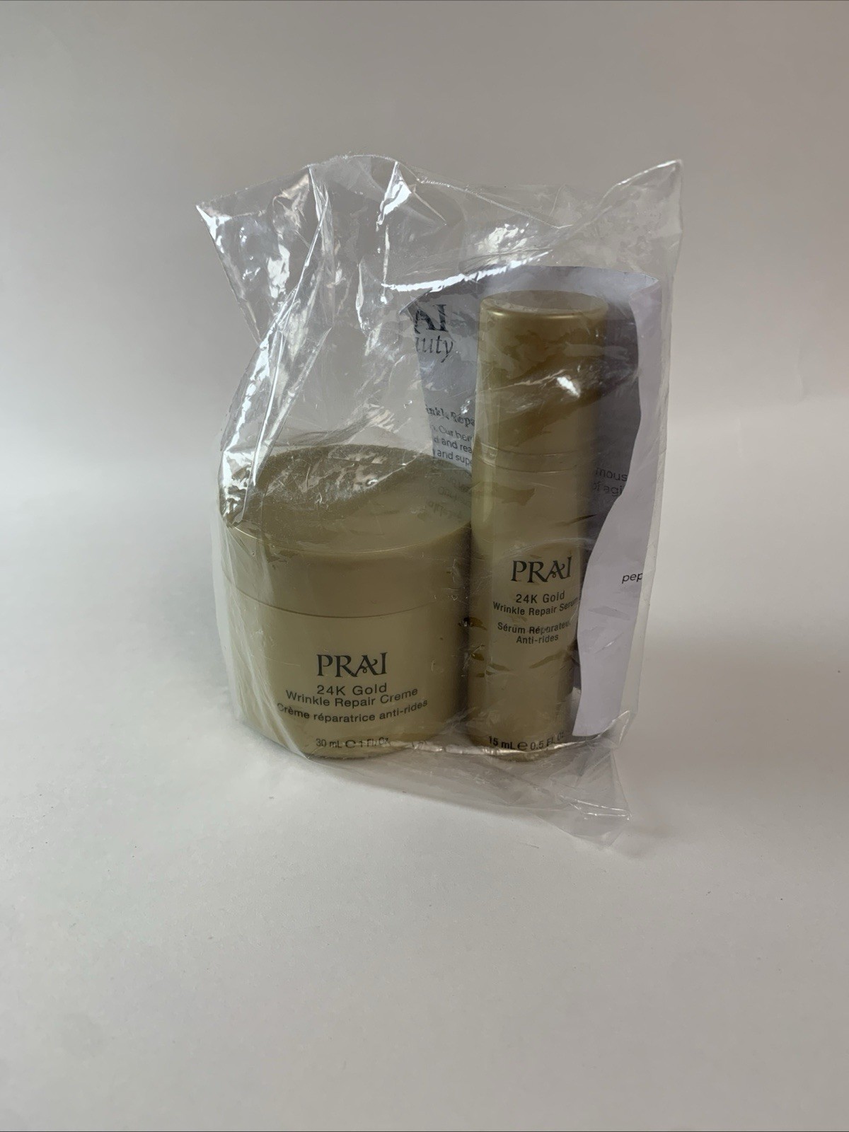 NEW PRAI 24K Gold Wrinkle Repair Creme 1oz + Serum 0.5oz Duo HTF