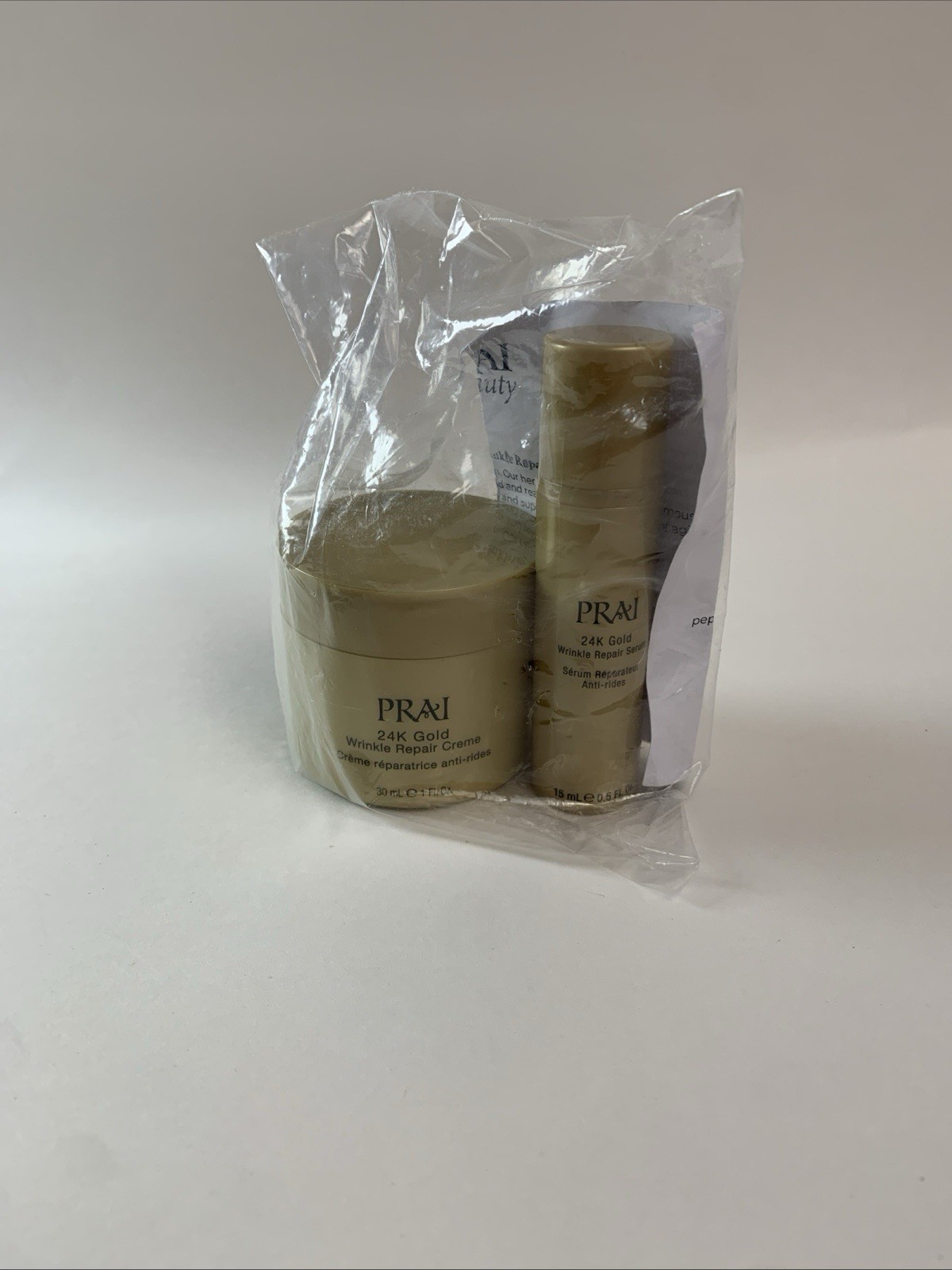 NEW PRAI 24K Gold Wrinkle Repair Creme 1oz + Serum 0.5oz Duo HTF
